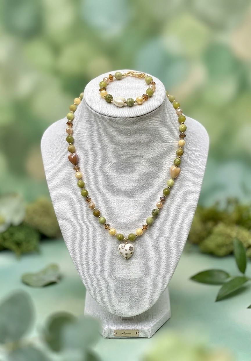 Faceted green jade bracelet with white ceramic heart